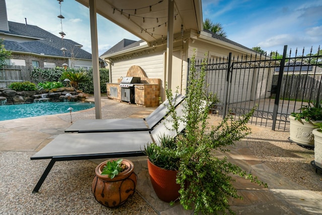 view of patio featuring area for grilling, a grill, and a fenced backyard