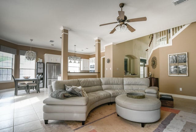 2910 Lara Brook Ct, Katy, TX 77494 - living room with healthy amount of natural light, ceiling fan, baseboards, and light tile patterned flooring