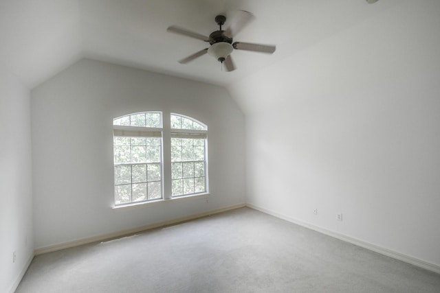 2910 Lara Brook Ct, Katy, TX 77494 - empty room featuring carpet floors, a ceiling fan, vaulted ceiling, and baseboards