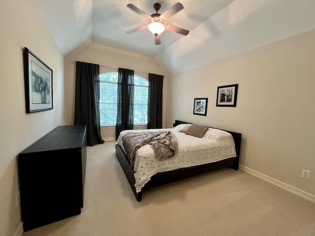 2910 Lara Brook Ct, Katy, TX 77494 - bedroom with light carpet, vaulted ceiling, baseboards, and a ceiling fan
