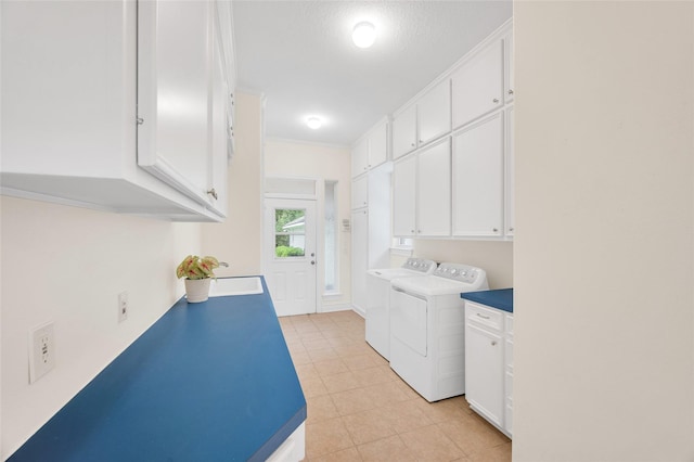 522 Rancho Bauer Dr, Houston, TX 77079 - laundry room with separate washer and dryer, cabinet space, and light tile patterned floors