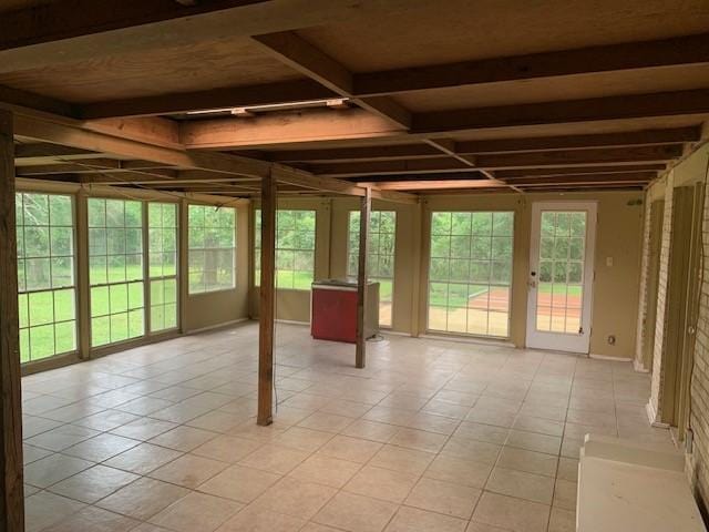 unfurnished sunroom featuring french doors