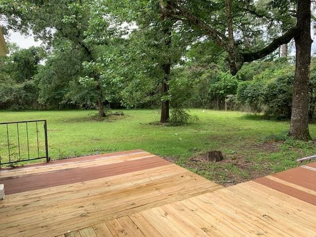 deck featuring a lawn