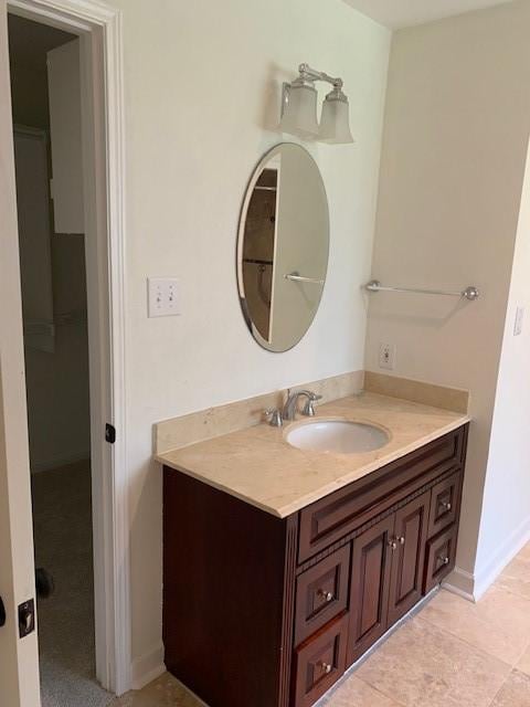 bathroom featuring vanity and baseboards