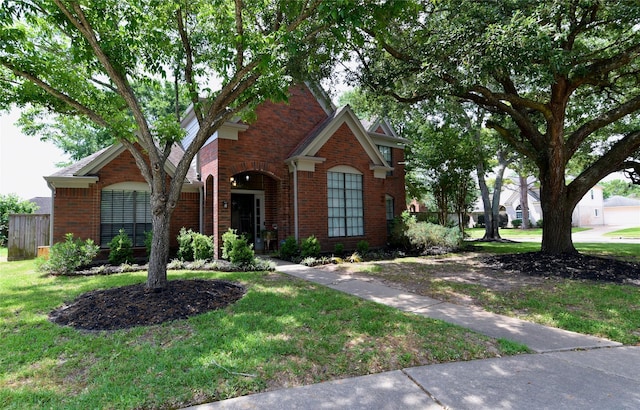 18411 Arrow Flint Cv, Houston, TX 77084 - traditional-style home with brick siding and a front yard