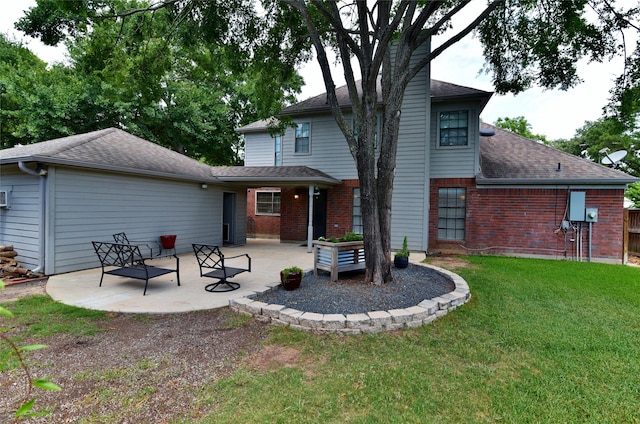 18411 Arrow Flint Cv, Houston, TX 77084 - rear view of house with a patio, brick siding, a lawn, and a shingled roof