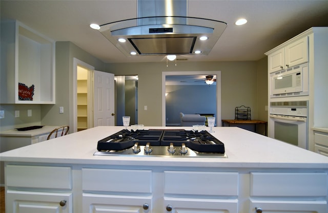 18411 Arrow Flint Cv, Houston, TX 77084 - kitchen with white appliances, light countertops, white cabinets, recessed lighting, and ceiling fan