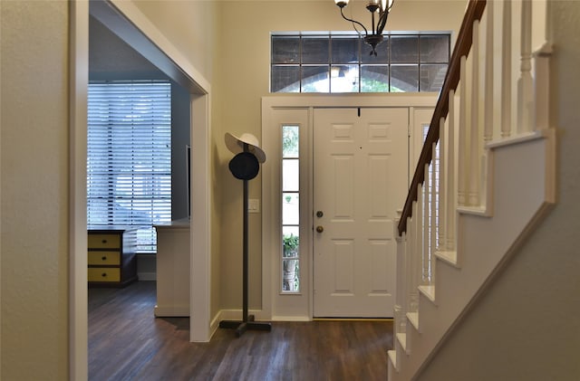 18411 Arrow Flint Cv, Houston, TX 77084 - entryway featuring dark wood finished floors, stairs, baseboards, and a chandelier
