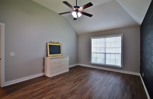 18411 Arrow Flint Cv, Houston, TX 77084 - empty room with lofted ceiling, dark wood finished floors, a ceiling fan, and baseboards