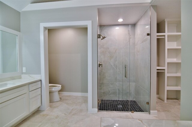 18411 Arrow Flint Cv, Houston, TX 77084 - bathroom with a stall shower, toilet, baseboards, vanity, and tile patterned floors