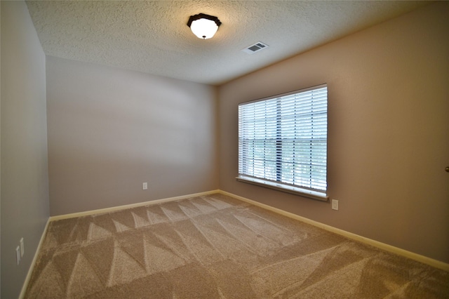 18411 Arrow Flint Cv, Houston, TX 77084 - unfurnished room featuring a textured ceiling, light carpet, and baseboards