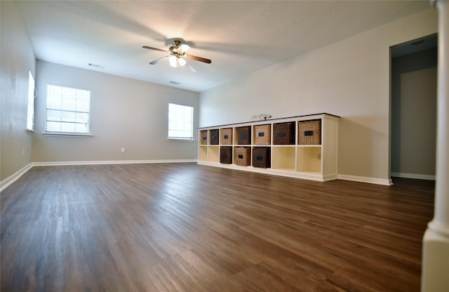 18411 Arrow Flint Cv, Houston, TX 77084 - empty room featuring ceiling fan, dark wood-style floors, and baseboards