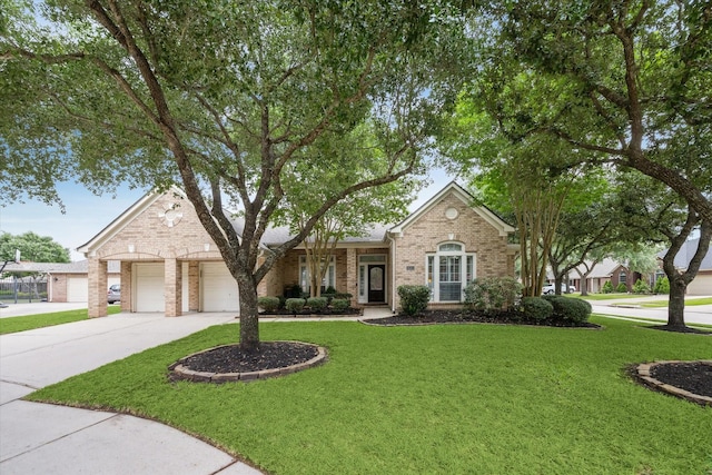 view of front of property with brick siding, a front lawn, concrete driveway, and an attached garage