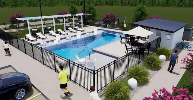 community pool featuring fence, a wooded view, and a patio