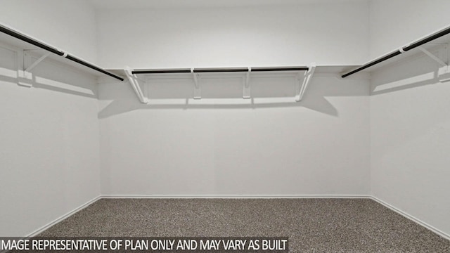 5427 Magnolia Heath Ln, Spring, TX 77373 - walk in closet with carpet flooring