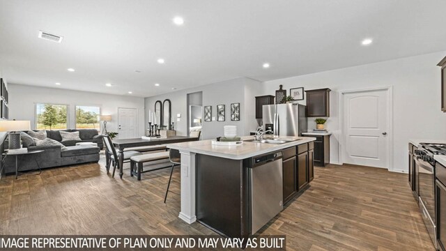 5427 Magnolia Heath Ln, Spring, TX 77373 - kitchen with stainless steel appliances, a sink, open floor plan, dark wood-style flooring, and recessed lighting