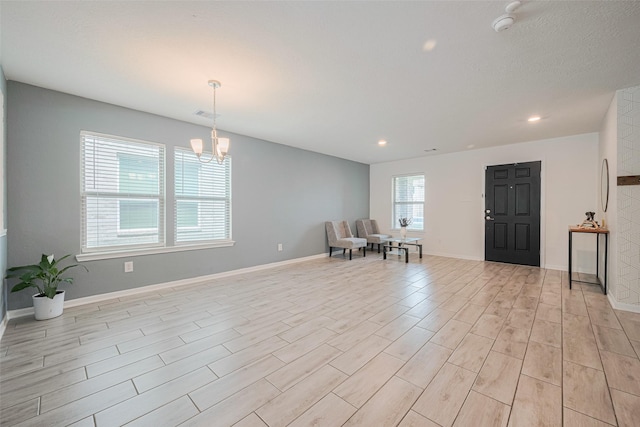 20864 Sheffield Park Dr, Porter, TX 77365 - foyer featuring light wood-style flooring, a chandelier, recessed lighting, and baseboards