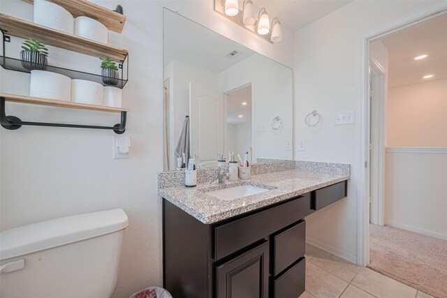 20864 Sheffield Park Dr, Porter, TX 77365 - bathroom with vanity, toilet, tile patterned floors, recessed lighting, and baseboards