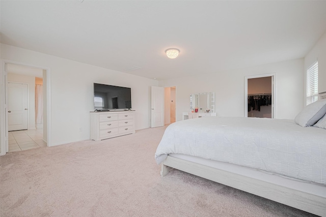 20864 Sheffield Park Dr, Porter, TX 77365 - bedroom featuring light carpet and a walk in closet