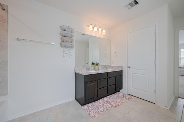 20864 Sheffield Park Dr, Porter, TX 77365 - bathroom with double vanity, baseboards, and tile patterned flooring