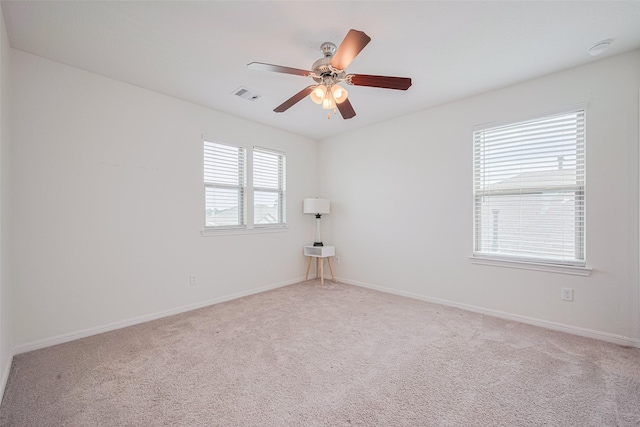 20864 Sheffield Park Dr, Porter, TX 77365 - carpeted spare room featuring ceiling fan, baseboards, and a smoke detector
