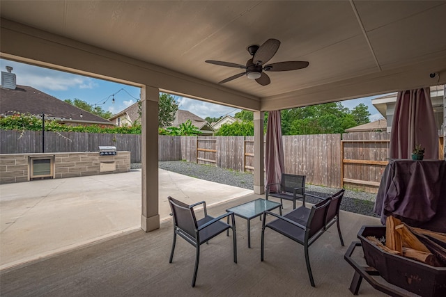 20864 Sheffield Park Dr, Porter, TX 77365 - fenced backyard featuring a patio area, a ceiling fan, and wine cooler