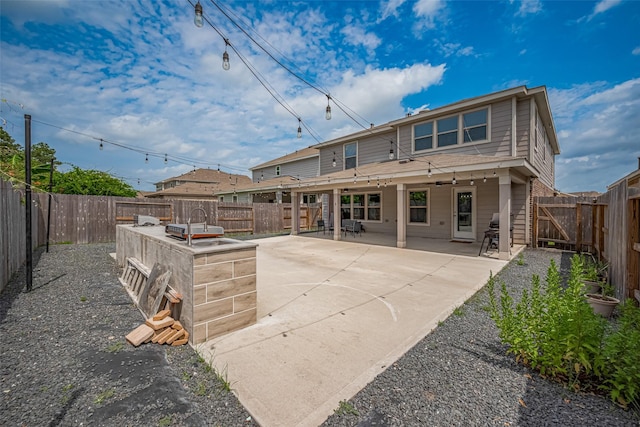 20864 Sheffield Park Dr, Porter, TX 77365 - back of house featuring a patio and a fenced backyard