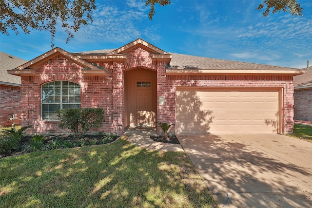 view of front of property with brick siding, a garage, concrete driveway, a front lawn, and roof with shingles