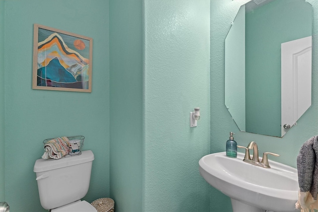 107 San Jacinto Dr, Baytown, TX 77523 - bathroom with toilet and a sink