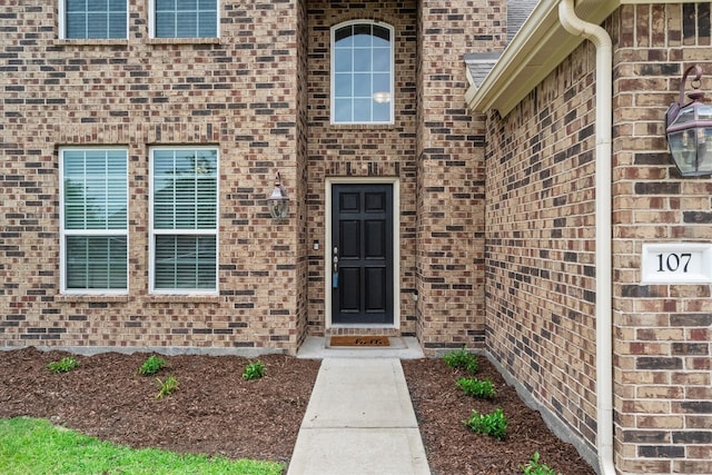 107 San Jacinto Dr, Baytown, TX 77523 - doorway to property with brick siding