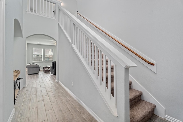 107 San Jacinto Dr, Baytown, TX 77523 - stairs with wood finished floors, baseboards, and a ceiling fan