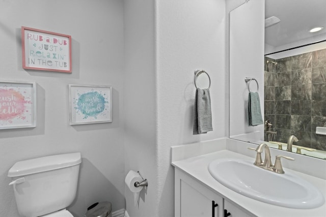 107 San Jacinto Dr, Baytown, TX 77523 - full bathroom featuring vanity, toilet, and a shower