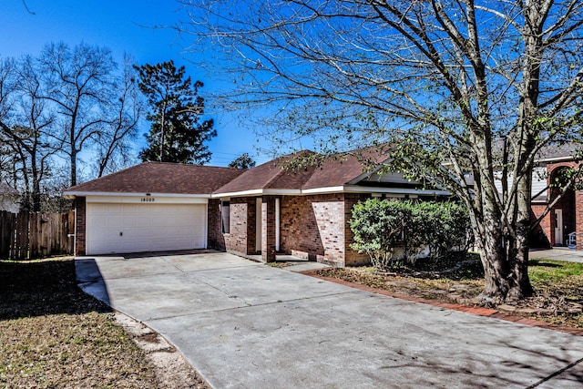 14089 Broken Arrow Dr, Willis, TX 77378 - ranch-style home featuring brick siding, driveway, an attached garage, and fence