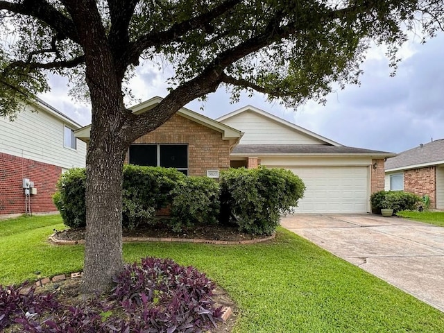 ranch-style house featuring driveway, a front lawn, an attached garage, and brick siding