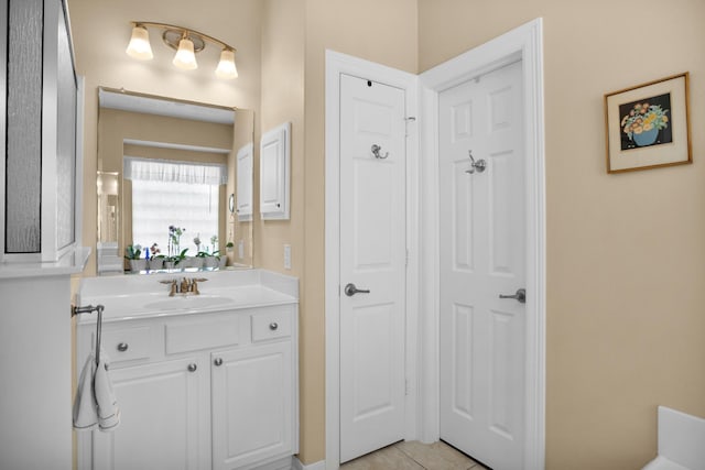 bathroom with vanity and tile patterned floors