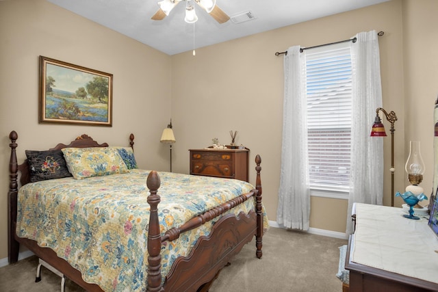 bedroom with light carpet, baseboards, and ceiling fan