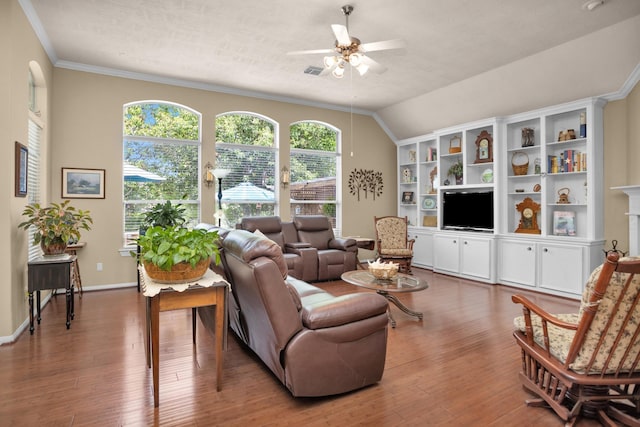 living area with a ceiling fan, wood finished floors, ornamental molding, baseboards, and lofted ceiling