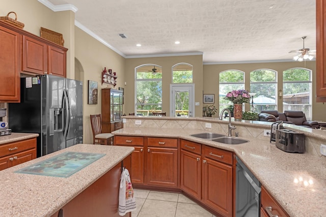 kitchen featuring a ceiling fan, fridge with ice dispenser, a sink, dishwasher, and ornamental molding