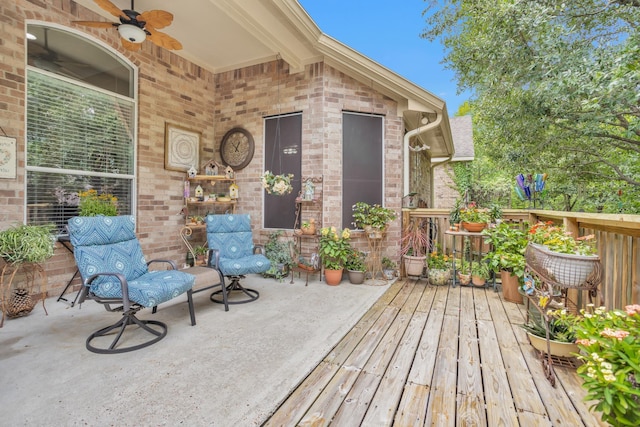deck featuring ceiling fan and a patio area