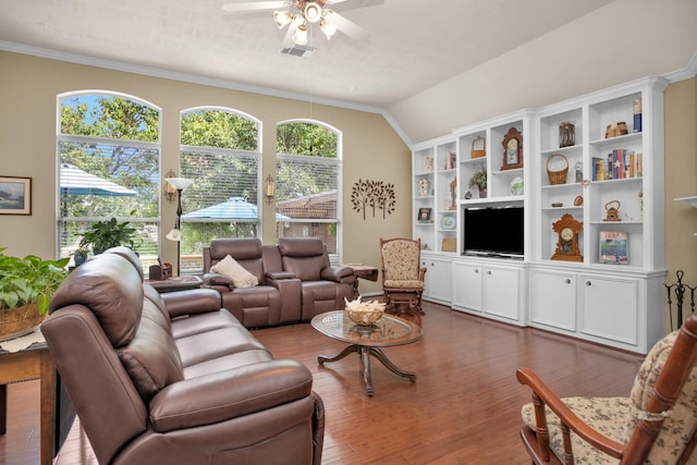 living room featuring ceiling fan, wood finished floors, lofted ceiling, and ornamental molding