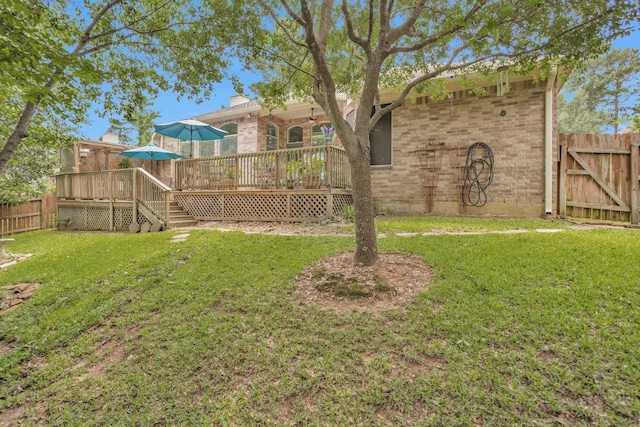 view of yard featuring a deck and stairway