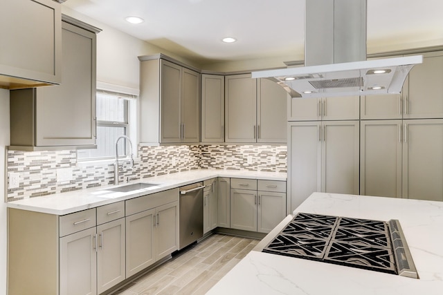 kitchen featuring a sink, island exhaust hood, stainless steel dishwasher, gray cabinetry, and recessed lighting