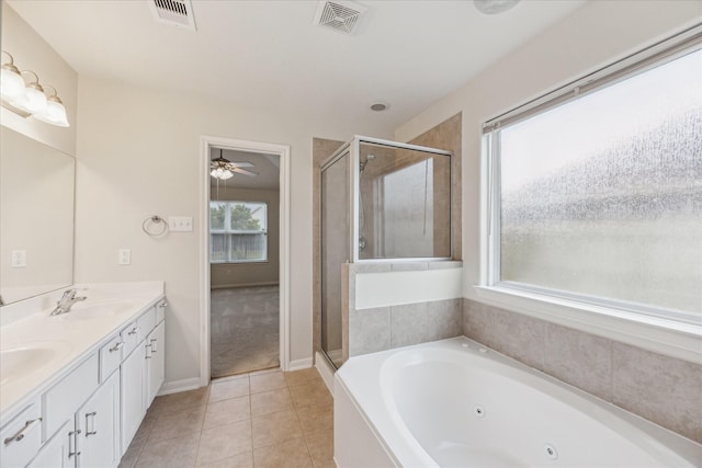 243 S Lantana Cir, Sealy, TX 77474 - full bath featuring a shower stall, a jetted tub, tile patterned flooring, ceiling fan, and double vanity