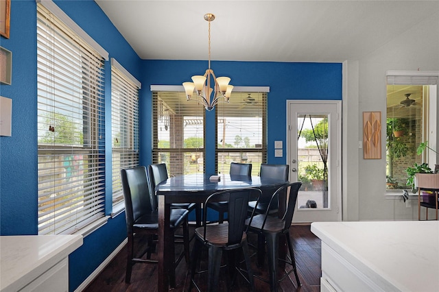 9615 Carson Ln, Iowa Colony, TX 77583 - dining area featuring dark wood-style flooring, a chandelier, and baseboards