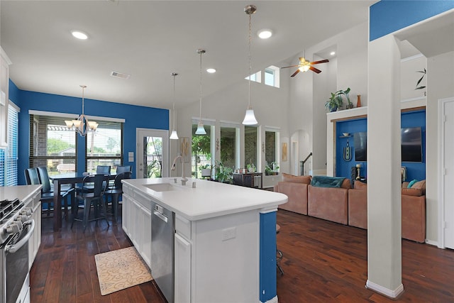 9615 Carson Ln, Iowa Colony, TX 77583 - kitchen with a ceiling fan, dark wood-style floors, a sink, a chandelier, and recessed lighting