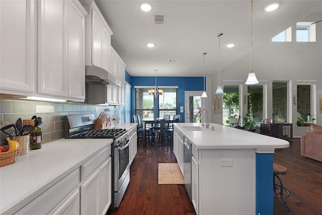 9615 Carson Ln, Iowa Colony, TX 77583 - kitchen with stainless steel appliances, a sink, extractor fan, light countertops, and white cabinetry