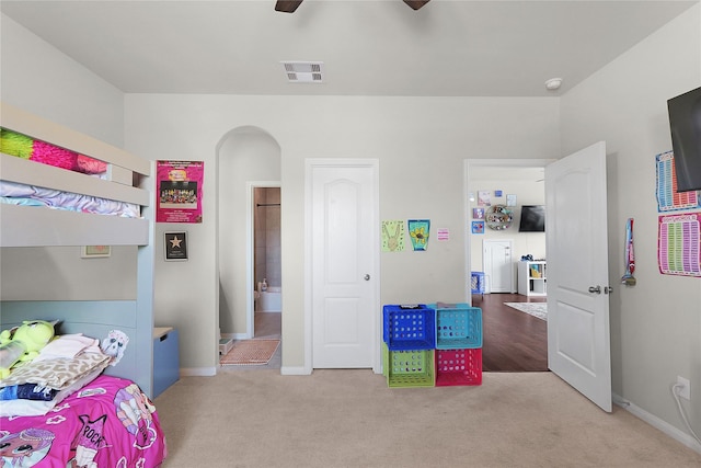 9615 Carson Ln, Iowa Colony, TX 77583 - carpeted bedroom with baseboards, arched walkways, and ceiling fan