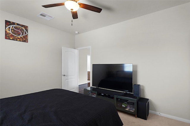 9615 Carson Ln, Iowa Colony, TX 77583 - bedroom with light colored carpet, baseboards, and ceiling fan