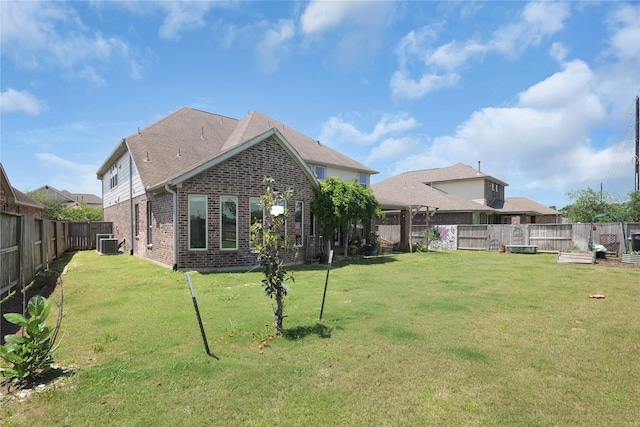 9615 Carson Ln, Iowa Colony, TX 77583 - back of property with central AC unit and brick siding