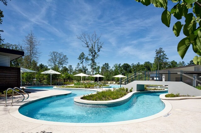 27846 Wooded Pond Dr, Spring, TX 77386 - community pool featuring a patio and fence